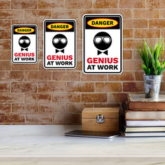 Portrait Round Plus Danger Genius At Work Wall or Door Sign | Easy Installation | Funny Novelty Imitation Warning Signs