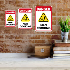 Portrait Round Plus Danger Men Cooking (BBQ) Wall or Door Sign | Easy Installation | Funny Novelty Imitation Warning Signs