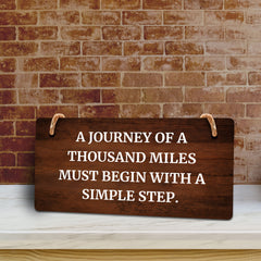 A Journey Of A Thousand Miles Must Begin With A Simple Step. 5x10 Hanging Plus Wall or Door Sign | Funny & Motivational Home Decor