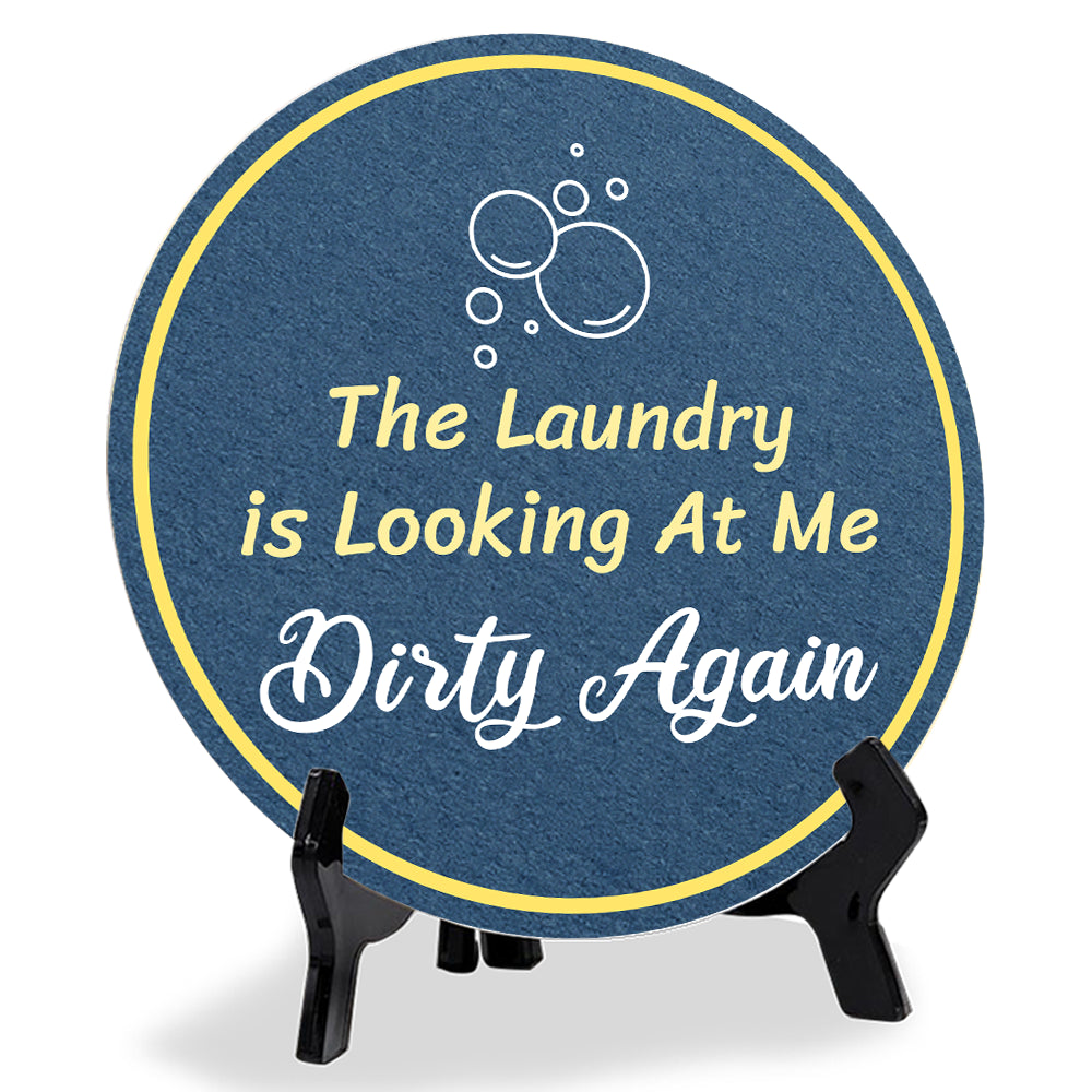 The Laundry Is Looking At Me Dirty Again (5 x 5“) Circle Table Sign with Acrylic Stand | Funny Home Decor