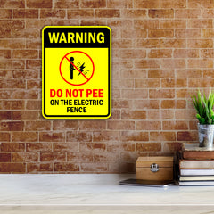 Portrait Round Plus Warning Do Not Pee On The Electric Fence Door or Wall Sign | Funny Warning Sign For Decoration