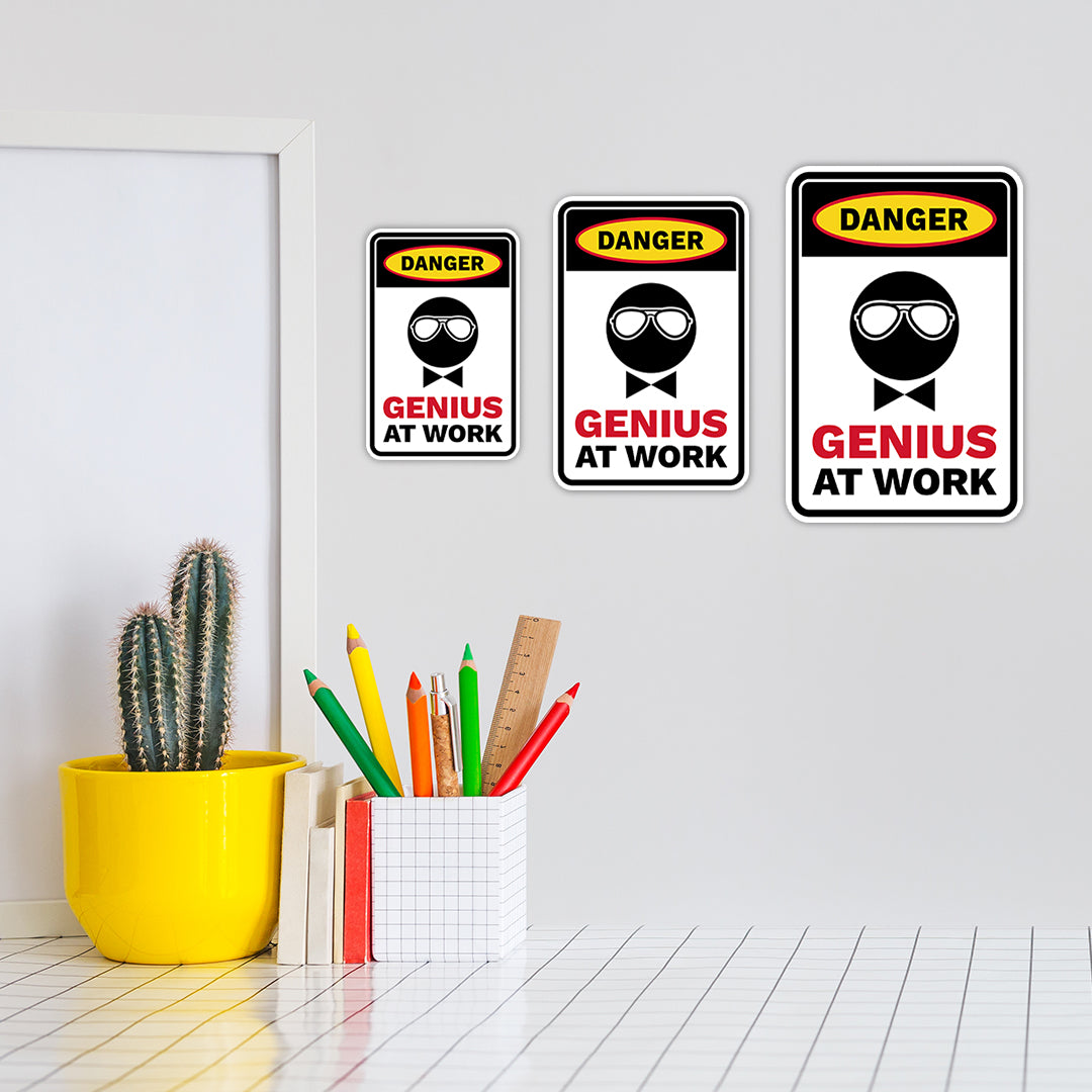 Portrait Round Plus Danger Genius At Work Wall or Door Sign | Easy Installation | Funny Novelty Imitation Warning Signs